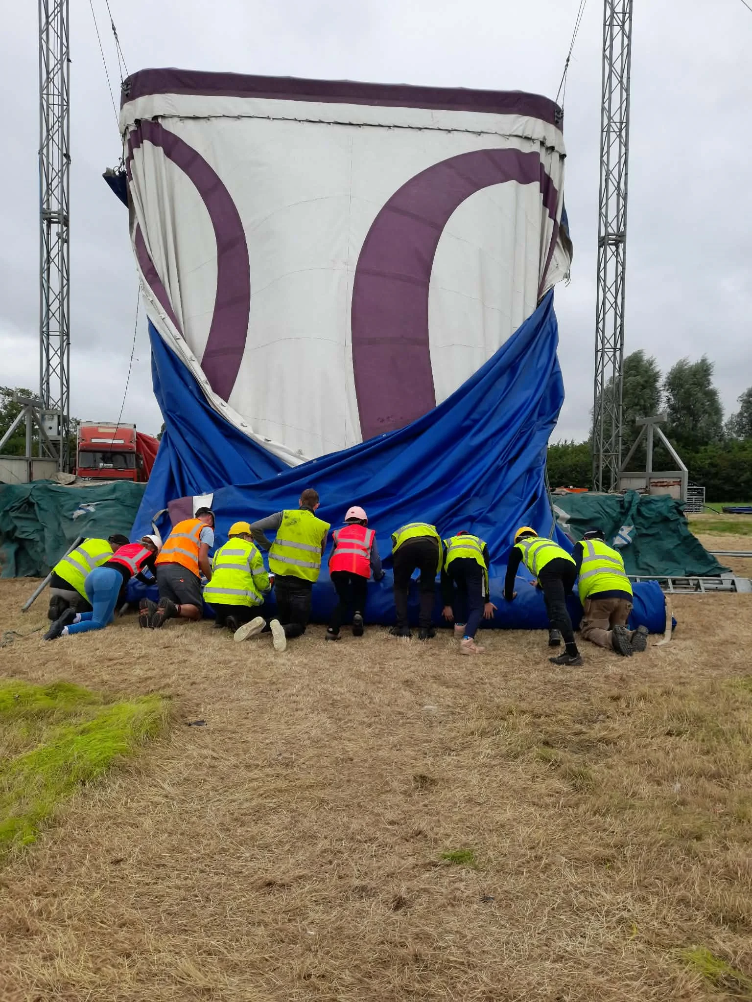 Wonder Circus team packing the tent away for travel